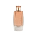 Maison Alhambra Glossy By Maison Alhambra 100ml Women EDP — A tall, clear glass perfume bottle with a rose gold cap, filled with a light peachy-pink liquid. The word "GLOSSY" is embossed vertically on the front, with a deer silhouette and "MAISON A. ALHAMBRA" below.