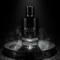Maison Alhambra Salvo by Maison Alhambra For Him 100ml — Black glass perfume bottle with silver text 'SALVO EAU DE PARFUM' and a deer logo, resting on a textured dark stone coaster with wisps of smoke around it against a black background.