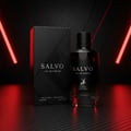 Maison Alhambra Salvo by Maison Alhambra For Him 100ml — Black perfume bottle and box displayed on a dark, textured surface with red neon light accents.