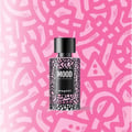 Mood Perfume Mood Pretty For Her 100 ml EDP — A black and pink patterned bottle of Mood Pretty For Her EDP, with a black cap, set against a vibrant pink abstract background.