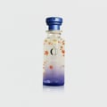 Osma Osma Bonsoir Cedarwood Warmth 150ml EDP — Clear glass perfume bottle with blue cap, decorated with falling orange and gold leaves, and a gradient purple base.