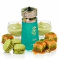 Paris Corner Khair Pistachio by Paris Corner 100ml EDP — Teal bottle with gold cap, surrounded by pistachio macarons, baklava, and pistachio dessert cups.