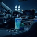 Above the Clouds by Volare 100 ml Men — Botol dan kotak wangian di dalam kereta mewah pada waktu malam, dengan latar belakang bandar berkilauan.