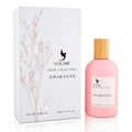 Volare Amaranth Niche by Volare – 100 ml for Her, pink perfume bottle with wooden cap next to its white box with delicate pink floral illustration.