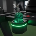 Volare Amazon Rainfall by Volare 100ml EDP Men — Green glass perfume bottle with silver cap, resting in a black illuminated holder on a treadmill console.
