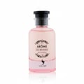 Volare Arome de Reverie Eau de Parfum — Botol minyak wangi merah jambu bertutup hitam, dengan label bulat hitam putih berserta teks dan grafik burung.
