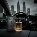 Volare Reload Intense by Volare Man – 100 ml for Him perfume bottle and box displayed inside a car with a city skyline in the background.