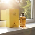 Volare Rise & Shine by Volare – 100 ml Unisex, featuring a yellow perfume box and a clear glass bottle with golden liquid, placed on a white surface with sunlight streaming from the left.