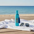 Zimaya Andalusi Blue by Zimaya 100ml EDP Men — A turquoise perfume bottle with a blue tassel sits on a white shirt, next to aviator sunglasses on a wooden deck with a beach and ocean in the background.