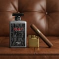 Zimaya Cult by Zimaya 100ml EDP Men — Botol wangian kelabu bertutup hitam, pemetik api emas, dan cerut di atas latar kulit coklat