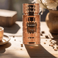 Zimaya Tiramisu Coco by Zimaya 100 ml EDP Unisex — Rose gold textured perfume bottle with 'tiramisu' and 'zimaya' labels, set on a wooden surface with coffee beans and a cup of coffee.