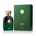 Zimaya Icon by Zimaya 100ml EDP Lelaki — Botol minyak wangi kaca hijau bertudung emas dan perincian zamrud, bersebelahan kotak hadiah hijau sepadan.