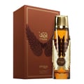 Zimaya Itqan Gold by Zimaya 100ml EDP Unisex — Kotak coklat bersayap emas dan teks Arab bersebelahan botol minyak wangi kaca jernih dengan perincian sayap emas dan penutup emas, menunjukkan cecair perang di dalam.