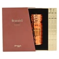Zimaya Tiramisu Coco EDP Unisex — Rose gold fluted perfume bottle with textured cap, presented in an open brown and gold textured box.