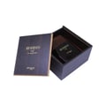 Zimaya Reserved Black Cedar by Zimaya EDP 100 ml — Dark wooden box open, revealing a black perfume bottle with gold text 'RESERVED OUD' and 'zimaya', lid is open and angled.