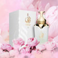 Zimaya Taraf White by Zimaya 100ml EDP Women — White perfume bottle and box with gold accents, surrounded by pink peonies.