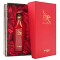 Zimaya Hawwa Red by Zimaya 100ml EDP Women — Red perfume bottle with gold accents, presented in a textured grey box lined with red satin, next to a red presentation box with gold Arabic calligraphy.