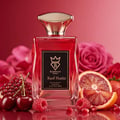 Bujairami Red Static Eau de Parfum — Red glass perfume bottle with gold cap, surrounded by fresh fruits like cherries, raspberries, strawberries, blood orange slices, and pomegranate seeds, with pink rose petals and a red background.