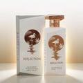 Gulf Orchid Reflection For Her 100ml by Gulf Orchid — White perfume bottle and box with a copper flamingo and palm leaf design, set against a soft golden gradient background. | Gulf Orchid Reflection For Her 100ml by Gulf Orchid — Botol dan kotak minyak wangi putih dengan rekaan flamingo tembaga dan daun palma
