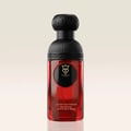 Bujairami Sacred Skin 100ml Extrait Unisex — Red glass perfume bottle with black textured cap and gold emblem, against a plain cream background.
