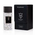 Bujairami Shadow Script - Bujairami 100ml Extrait — Clear faceted glass perfume bottle with a black wooden cap next to a black textured presentation box with silver branding.