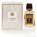 Ard Al Zaafaran Shahrazad Eau De Parfum — Set wangian Shahrazad Eau De Parfum 100ml oleh Ard Al Zaafaran, terdiri daripada botol kaca jernih dengan penutup emas dan kotak putih berhias corak daun emas.