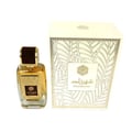 Ard Al Zaafaran Shahrazad Eau De Parfum 100ml — Botol kaca jernih berisi cecair keemasan, dengan penutup coklat gelap dan label emas. Kotak putih dengan corak daun emas turut dipaparkan di sebelah.