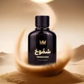 Gulf Orchid Shumookh Parfum 100ml by Gulf Orchid — A black perfume bottle with a gold crown logo and Arabic text, set against a desert-like background with swirling sand and soft golden light. | Gulf Orchid Shumookh Parfum 100ml by Gulf Orchid — Botol minyak wangi hitam dengan logo mahkota emas dan teks Arab, berlatar