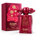 Asdaaf Sougha — Red perfume bottle with ornate floral red and gold paper cut-out design on its matching red box, featuring a unique red cap.