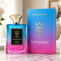 Bujairami Soul Fusion Intense — Blue and pink gradient glass perfume bottle with gold cap, next to its matching gradient box on a marble surface.