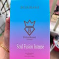 Bujairami Soul Fusion Intense — A gradient blue to purple box for Bujairami Soul Fusion Intense eau de parfum, featuring a crown and diamond logo with the letter B, and text.