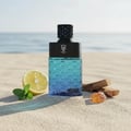 Bujairami Sovereign by Bujairami 100ml EDP — A blue gradient hexagonal patterned bottle on a sandy beach with a lemon slice, mint leaves, and amber resin.