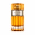 Afnan Stardust by Afnan 100ml Extrait Unisex — Minyak wangi warna ambar dalam botol kaca berlubang dengan penutup emas bergaris, di tengah latar belakang putih.