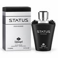TADangel Status by TADangel 100ml EDP Lelaki — Botol minyak wangi hitam dengan penutup perak dan perincian reben hitam, bersebelahan kotak hitam dan peraknya.