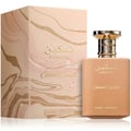 Paris Corner Taskeen Caramel Cascade 100ml — A perfume bottle and its box, both featuring a marble-like design with gold glitter accents. The bottle is a warm caramel color with a gold cap. | Paris Corner Taskeen Caramel Cascade 100ml — Botol minyak wangi dan kotaknya, kedua-duanya menampilkan reka bentuk seperti