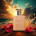 Paris Corner Taskeen Caramel Cascade 100ml — A peach-colored perfume bottle sits on a sandy beach with red flowers scattered around it, against a sunset sky and ocean waves. | Paris Corner Taskeen Caramel Cascade 100ml — Botol pewangi berwarna pic duduk di pantai berpasir dengan bunga merah bertaburan di