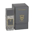 Bujairami World Power Oud Cacao Leather 100ml Extrait — Clear faceted glass perfume bottle with grey cap next to a grey presentation box with gold embossed logo and text