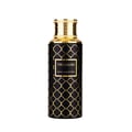 Maison Asrar Treasure by Maison Asrar 100ml EDP Unisex — Botol hitam corak geometri emas dan penutup berlubang emas, label tertulis TREASURE ROYAL COLLECTION