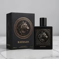 Rayhaan Wolf by Rayhaan 100ml EDP for Men — Black perfume box and bottle with embossed wolf head emblem, gold accents, on a marble surface.